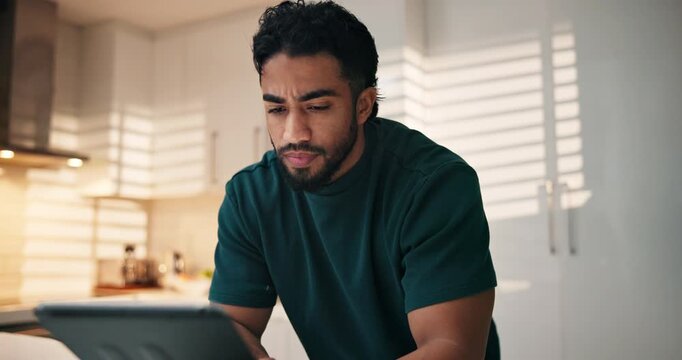 Search, thinking or man with tablet in home for text message, blog tips or reading online news. Coffee beverage, kitchen or Indian person checking notification for social media, download or article