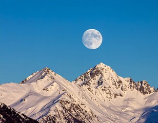 Full moon over snow-capped peaks
