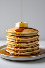  Stack of Pancakes with Butter and Dripping Maple Syrup