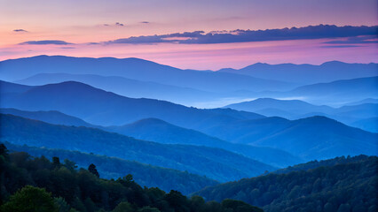 Obraz premium Serene blue mountain layers bathed in the soft hues of a vibrant sunrise sky