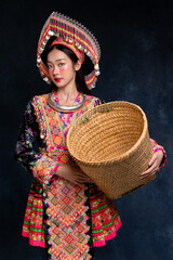 Portrait fashion of beauty young Asian woman wearing colorful traditional Hmong or Hmoob hill tribe...