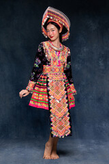 Portrait fashion of beauty young Asian woman wearing colorful traditional Hmong or Hmoob hill tribe...