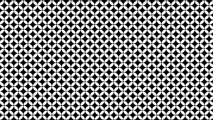 Seamless pattern of white flower shapes and black dots on a black background in a repeating design