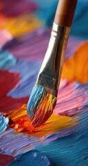 Obraz premium Close-up of vibrant paint strokes. A paintbrush dips into a colorful canvas