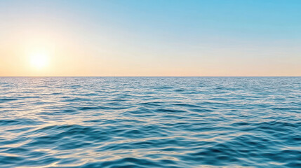 Obraz premium Calm sea with gentle waves reflecting pastel colors of sky at sunset