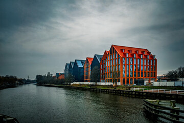 Cold autumn day in Elblag, modern houses on the riverbank