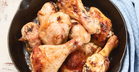 Fried chicken legs in pan