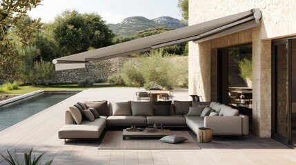 A spacious terrace setup with an L-shaped sofa, an outdoor rug, and a retractable awning for shade