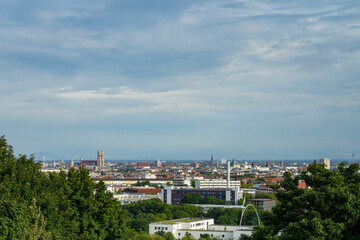 View from the vantage point in the Olympic Park, Munich, Bavaria, Germany. Park landscape and...