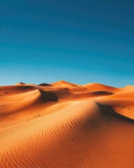 Vast desert landscape under vibrant blue sky