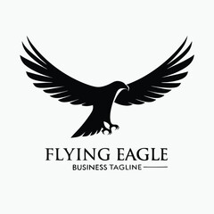 A majestic black eagle silhouette soars freely with outstretched wings in minimalist simplicity