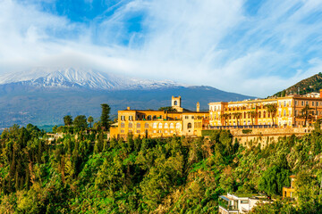 panoramic view of green mountains with palace and great top of a mountain on a cloudy sky...