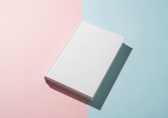 Blank white hardcover book on pastel pink and blue background for mockups and presentations