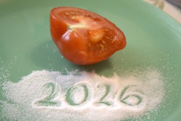 2026 subtitle or text in salt with half tomato and copy space