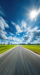 Empty asphalt road stretching into a bright, summer landscape