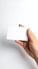 Obraz premium Hand holding a blank white card