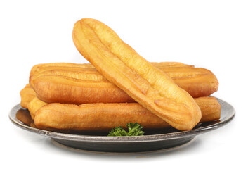 Crispy fritters served on a silver plate against a clean white background for traditional cuisine...