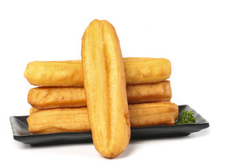 Crispy fritters stacked on a plate showcasing traditional snack flavors for a delightful culinary experience