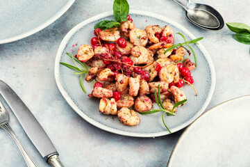 Fried seafood shrimps with berries sauce.