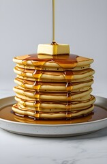 Delicious Stack of Pancakes with Dripping Maple Syrup and Butter