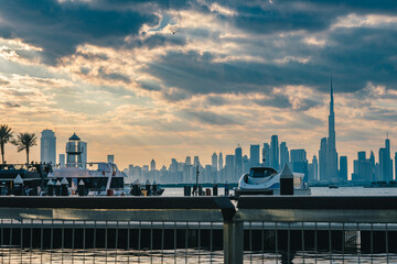View of Dubai Skyline from a from a Yacht at sunset, Yacht party at sunset, Scenic View Background,...