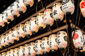Traditional Japanese Lanterns Hanging in Gion District at Night