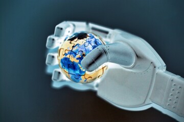 Artificial intelligence and technology shaping global future, robotic hand gently holding planet...