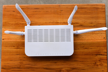 Close up of a computer wifi router kept on a wooden table