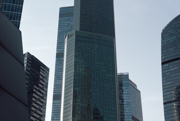 bottom view of the tall skyscrapers of the business district of a modern city