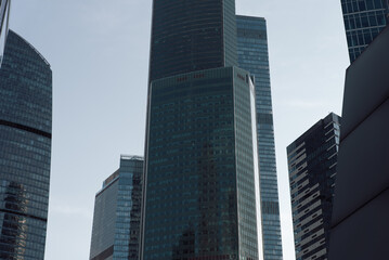 bottom view of the tall skyscrapers of the business district of a modern city