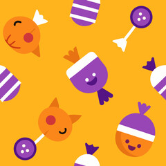 Cute halloween candies and rattles on orange background