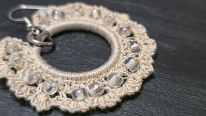 Round green earrings made of thin cotton threads, hand-knitted. Handmade. Jewelry for women.