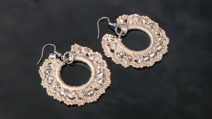 Round green earrings made of thin cotton threads, hand-knitted. Handmade. Jewelry for women.