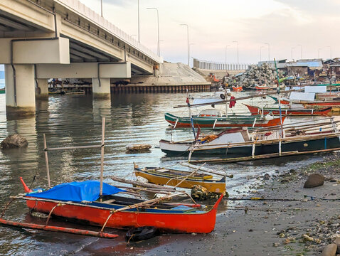 A raised highway running over sea water,past a poor coastal community in Davao city,Mindanao,the Philippines.