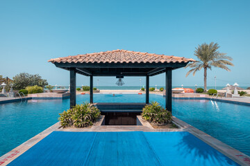 Covered Bar in between of swimming pool in Resort near Beach
