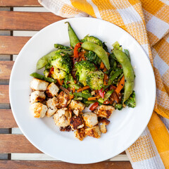 Edamame and Broccoli stir fry with Tofu, Silken Tofu with stir fried vegetables in a white ceramic block, Premium Asian food photography