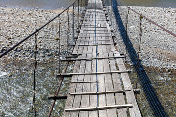 A wooden bridge over a body of water