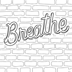 Handwritten word "Breathe" on a white brick wall background for World Mental Health Day  