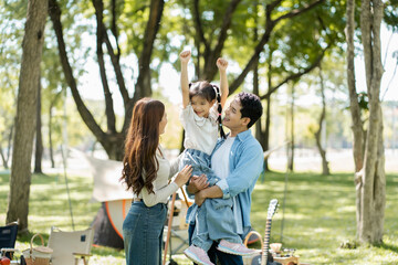 Happy asian family picnic in park, weekend lifestyle outdoors.