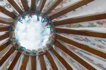 A colorful tent with a hole in the center