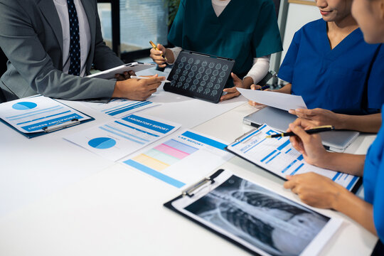 Medical Team Analyzes Patient Information and Medication Chart. - Powered by Adobe