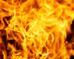 A close up of a flame with a yellowish orange color