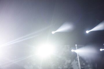 A bright light shining on a dark background, creating a sense of contrast
