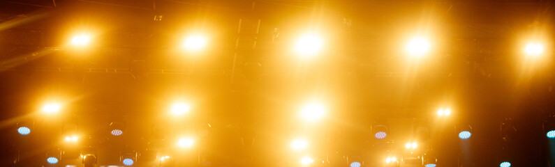 A bright yellow lighted ceiling with many lights