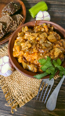 Stew of eggplant, pepper, onion and carrot. Home cooking. In a warm plate,