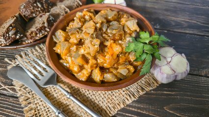 Stew of eggplant, pepper, onion and carrot. Home cooking. In a warm plate,