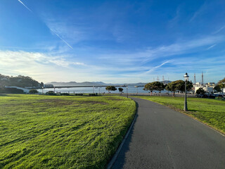 A park with a path leading to the water