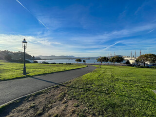 A park with a path leading to the water