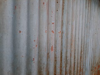 old rusty metal roof texture background. Rusted galvanized iron plate, red stain on old metal sheet wall texture. strip zinc wall background texture.