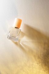 A refined perfume bottle bathed in golden light, exuding warmth, elegance, and timeless...